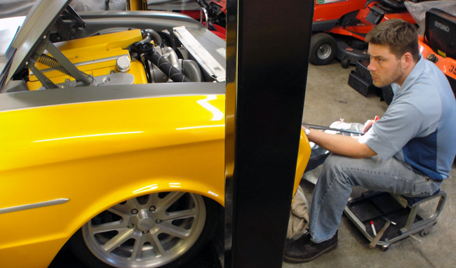 Classic car dent repair using paintless dent removal