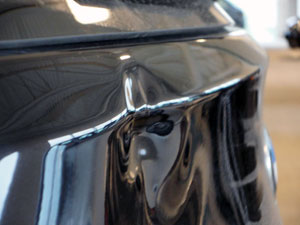 Huge dent in BMW tailgate repaired using PDR MN